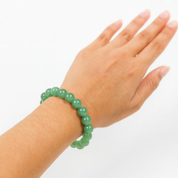 Green Aventurine bracelet on wrist for luck — Maayam India